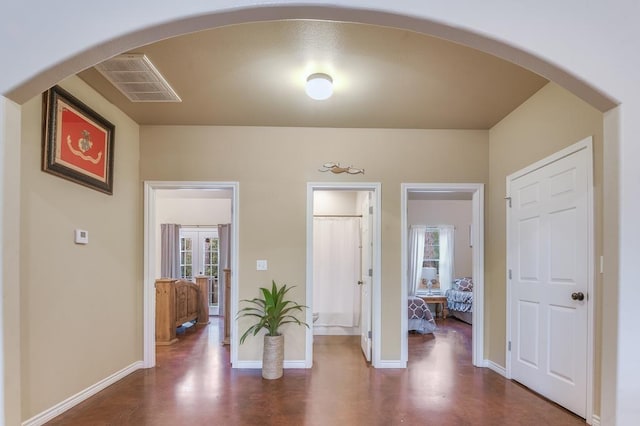 interior space with multiple windows and french doors