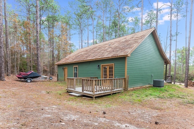 exterior space featuring central AC and a wooden deck