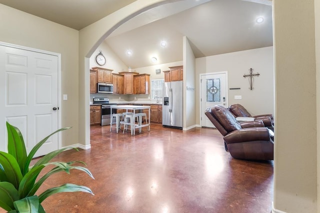 living room featuring lofted ceiling