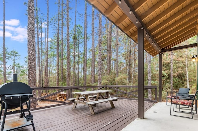 wooden terrace with a grill