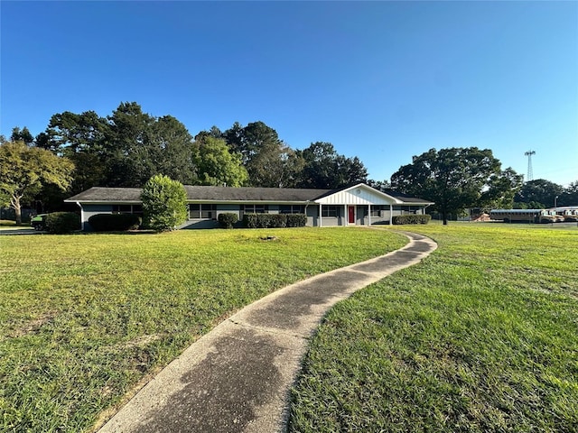 ranch-style home featuring a front yard