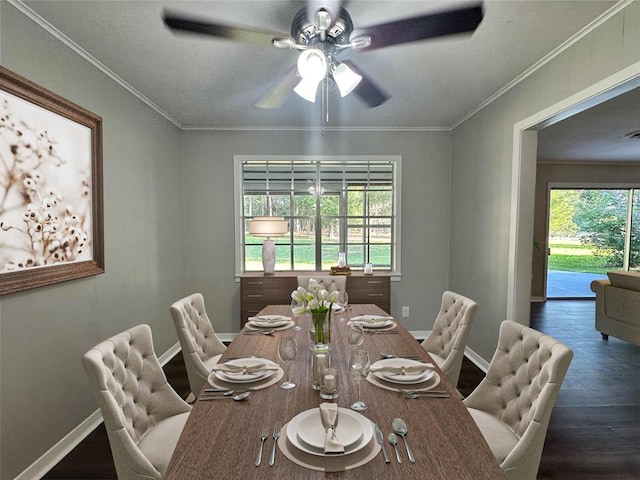 dining space with dark hardwood / wood-style flooring, ornamental molding, and ceiling fan