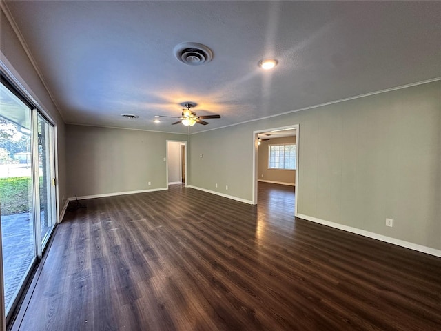 spare room featuring ornamental molding, dark hardwood / wood-style floors, and ceiling fan