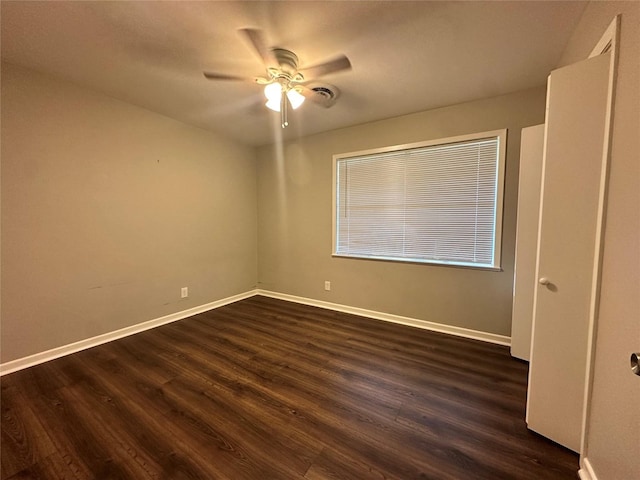 unfurnished bedroom with dark wood-type flooring and ceiling fan