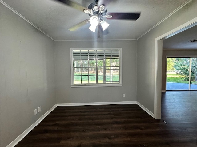 empty room with dark wood-type flooring, ceiling fan, and crown molding