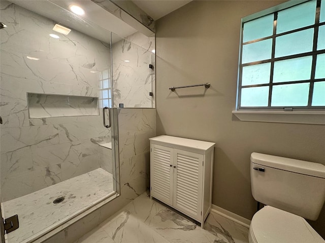 bathroom with walk in shower and toilet