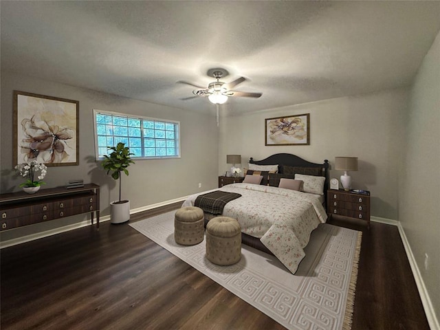 bedroom with dark wood-type flooring and ceiling fan