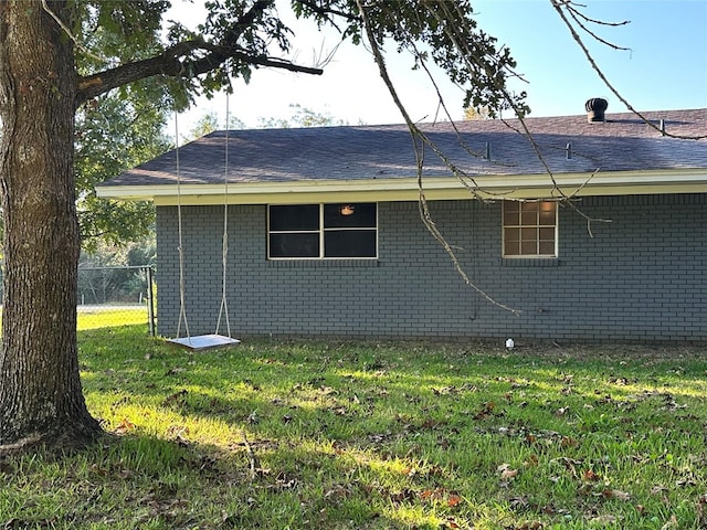 view of property exterior with a yard