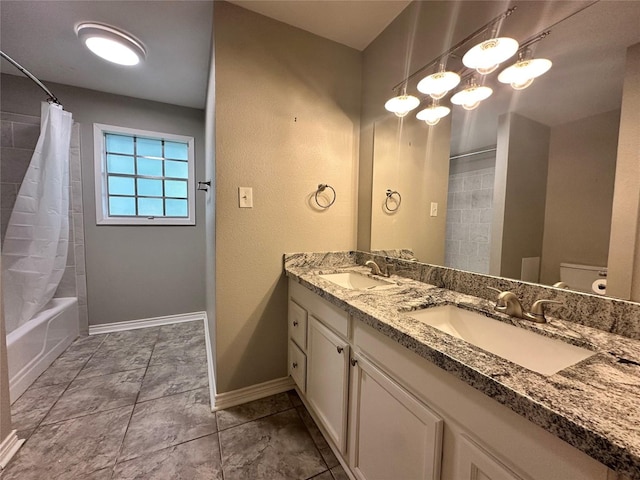 full bathroom featuring shower / bath combo, vanity, and toilet