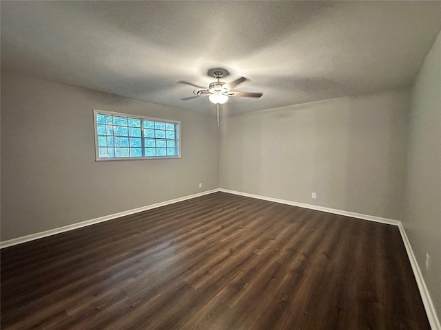 unfurnished room featuring dark hardwood / wood-style floors and ceiling fan