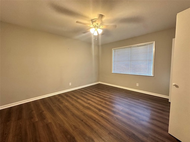 empty room featuring dark hardwood / wood-style floors and ceiling fan