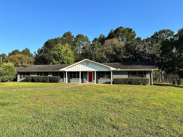 ranch-style house with a front lawn