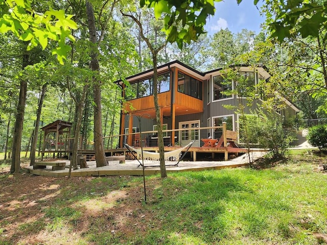 203 Bogey Ln, Brookeland, TX 75931 - rear view of property with a deck