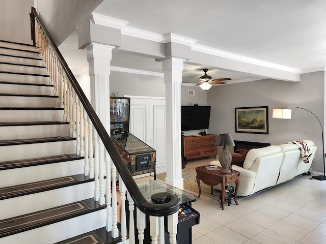203 Bogey Ln, Brookeland, TX 75931 - staircase featuring ornate columns, ceiling fan, tile patterned floors, and crown molding