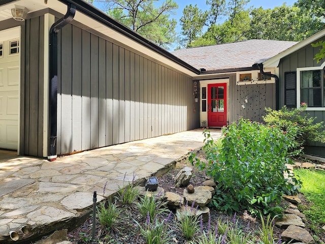 203 Bogey Ln, Brookeland, TX 75931 - property entrance featuring roof with shingles