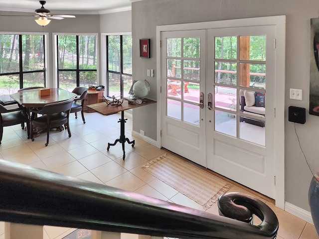 203 Bogey Ln, Brookeland, TX 75931 - tiled dining space featuring french doors, ornamental molding, and a ceiling fan