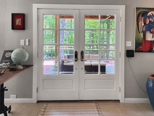 203 Bogey Ln, Brookeland, TX 75931 - entryway with tile patterned floors and french doors
