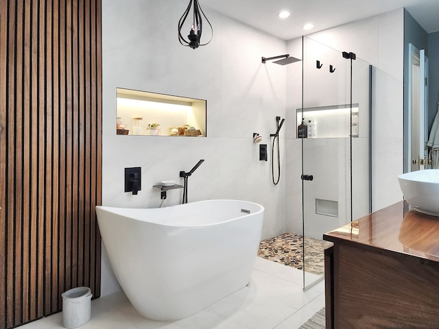 203 Bogey Ln, Brookeland, TX 75931 - full bathroom featuring walk in shower, a freestanding tub, recessed lighting, and vanity