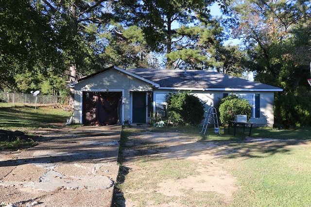 view of front of home featuring a garage and a front yard