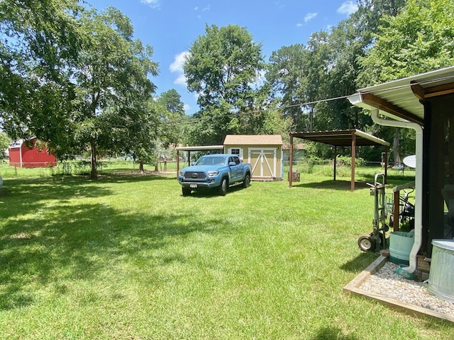 view of yard featuring a carport and a shed