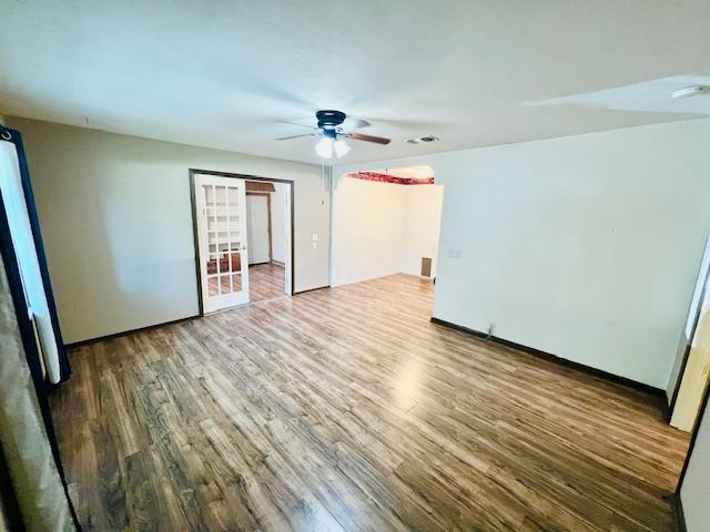 unfurnished bedroom featuring ceiling fan and wood-type flooring