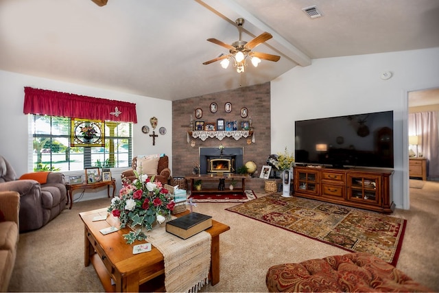 carpeted living room with vaulted ceiling with beams, ceiling fan, and a wood stove