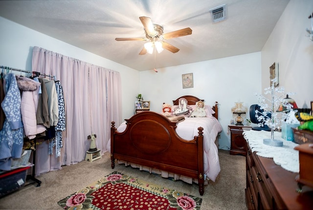 bedroom featuring ceiling fan and light carpet