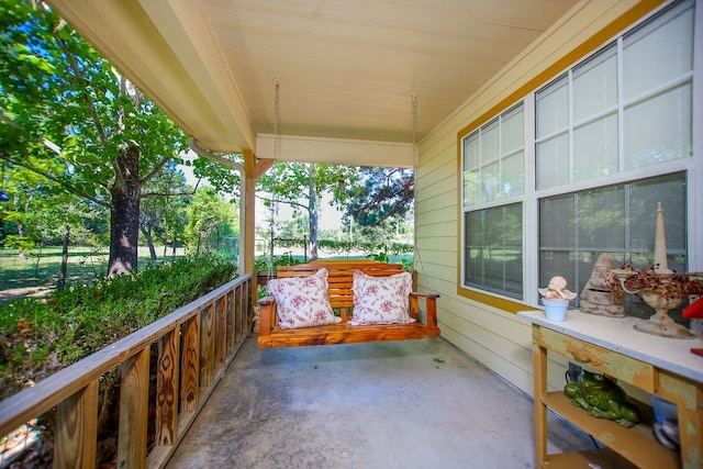 balcony featuring a porch