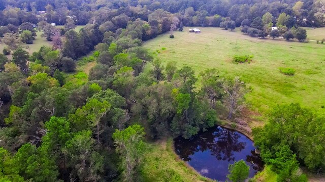 drone / aerial view featuring a rural view and a water view