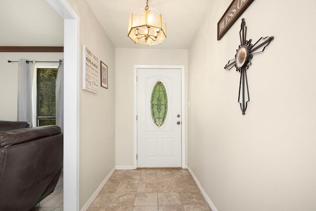 doorway with a chandelier