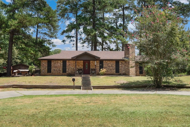 ranch-style home with a front lawn