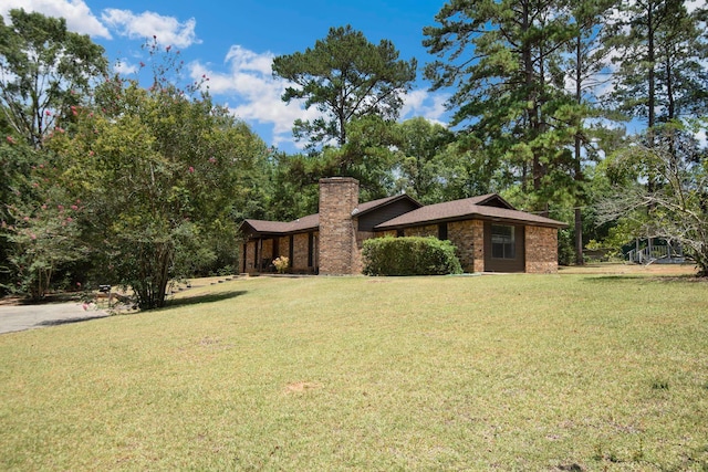 view of front of home with a front yard