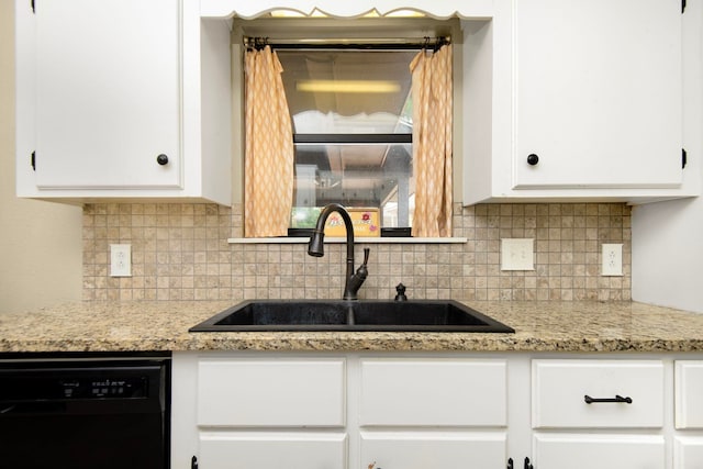 kitchen featuring dishwasher, tasteful backsplash, white cabinetry, and sink