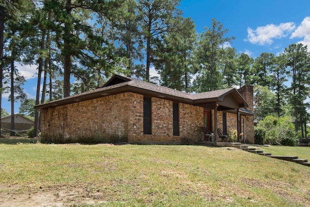view of home's exterior featuring a yard