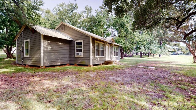 view of home's exterior with a yard