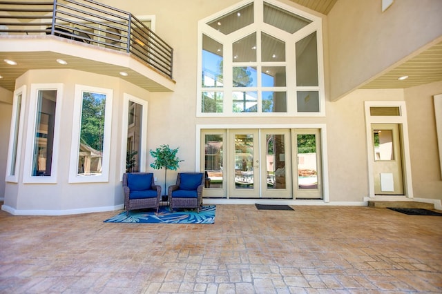 205 Twin Crk, Lufkin, TX 75904 - entrance to property featuring french doors, stucco siding, a balcony, and a patio