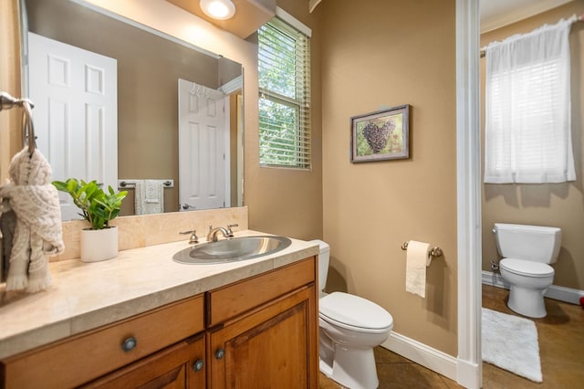 205 Twin Crk, Lufkin, TX 75904 - bathroom featuring toilet, vanity, baseboards, and tile patterned floors