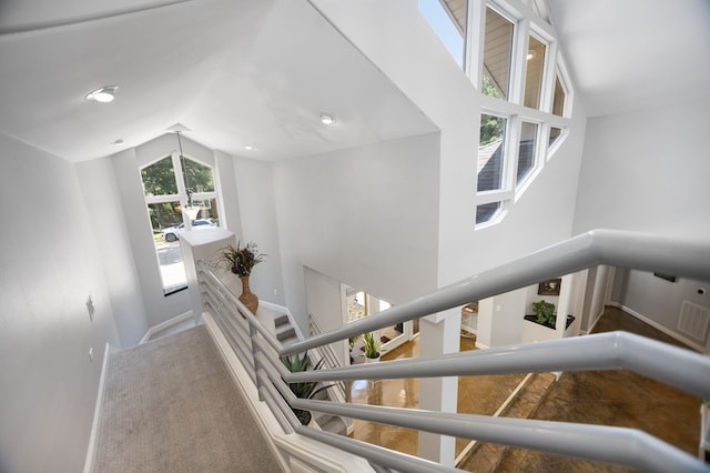 205 Twin Crk, Lufkin, TX 75904 - stairway featuring lofted ceiling and baseboards