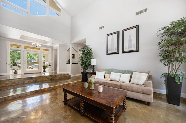 205 Twin Crk, Lufkin, TX 75904 - living room with a chandelier, baseboards, high vaulted ceiling, and ornamental molding