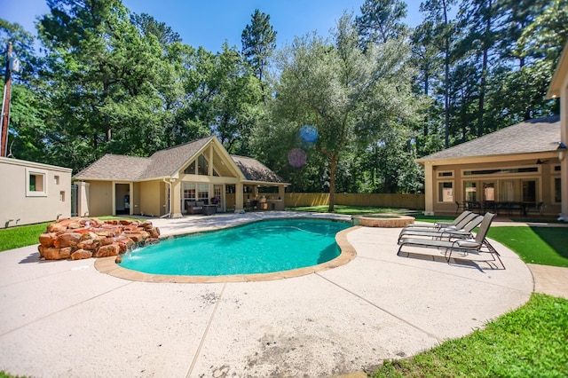 205 Twin Crk, Lufkin, TX 75904 - view of pool with a patio area, a storage structure, an outdoor structure, a pool with connected hot tub, and view of scattered trees