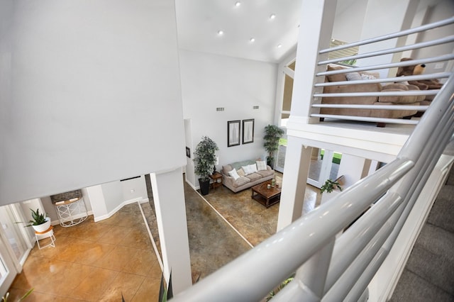 205 Twin Crk, Lufkin, TX 75904 - stairs featuring plenty of natural light, a high ceiling, recessed lighting, and tile patterned flooring