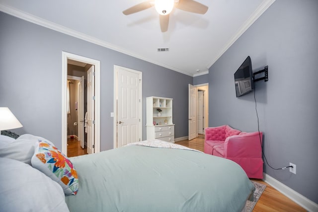 205 Twin Crk, Lufkin, TX 75904 - bedroom with crown molding, wood finished floors, baseboards, and a ceiling fan