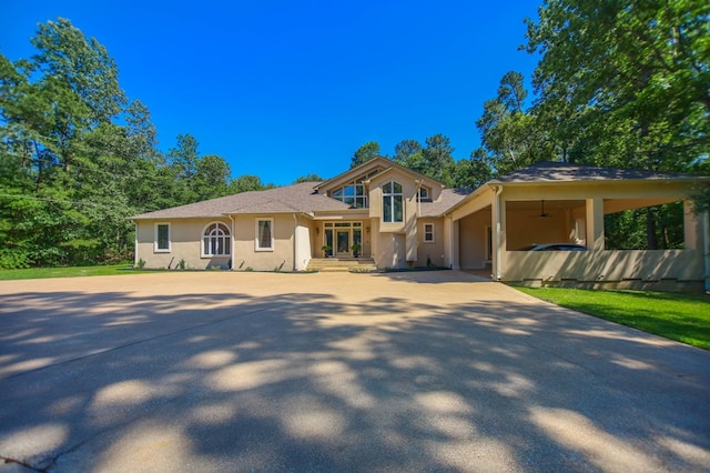 205 Twin Crk, Lufkin, TX 75904 - view of front facade with stucco siding, driveway, and an attached garage