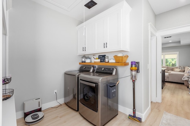 190 Whitehead Dr, Diboll, TX 75941 - laundry room with washer and dryer, cabinet space, light wood finished floors, and baseboards