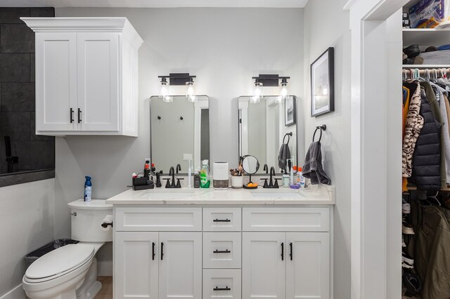 190 Whitehead Dr, Diboll, TX 75941 - full bath with double vanity, toilet, and a spacious closet