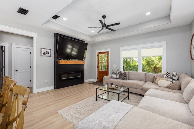 190 Whitehead Dr, Diboll, TX 75941 - living area featuring a raised ceiling, recessed lighting, light wood-type flooring, ceiling fan, and baseboards