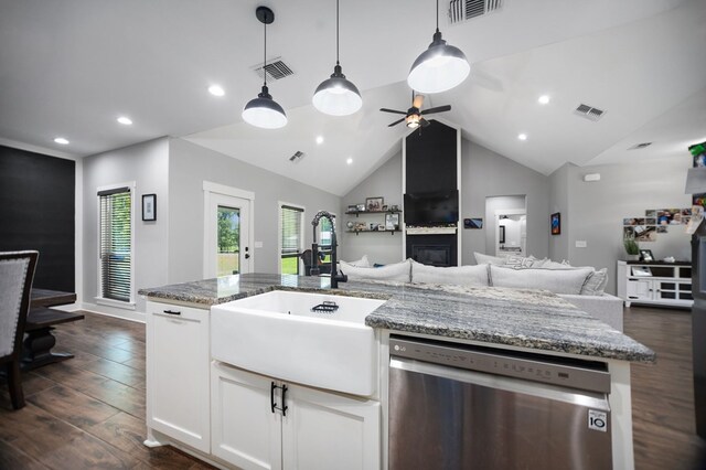 1065 Cc Rd, Diboll, TX 75941 - kitchen featuring dishwasher, open floor plan, a sink, dark wood finished floors, and white cabinetry