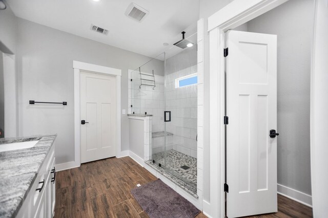 1065 Cc Rd, Diboll, TX 75941 - full bath with a stall shower, vanity, baseboards, and wood finished floors
