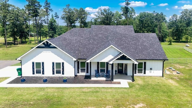 1065 Cc Rd, Diboll, TX 75941 - view of front of home with roof with shingles and a patio area