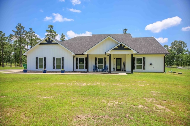 1065 Cc Rd, Diboll, TX 75941 - rear view of property featuring roof with shingles, a lawn, and board and batten siding